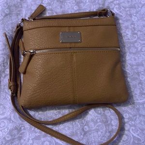 A nine west tan purse.